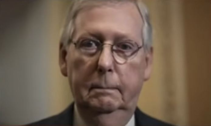 Mitch McConnell, seen here calmly watching an orphanage burn
