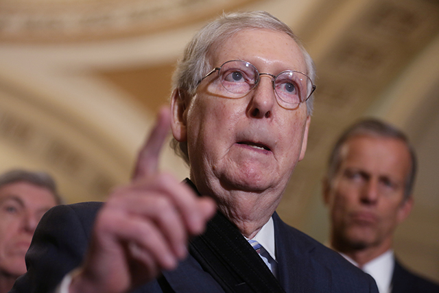 Mitch McConnell, senator and ghost pointing to where the murder happened . . .