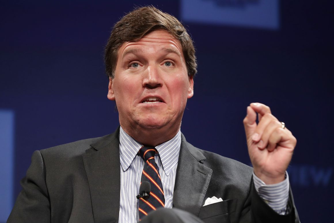 Tucker Carlson, seen here illustrating the size of his balls.